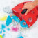 Boon Bug Pod Bath Toy Scoop in Red