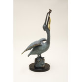 Pelican Eating Fish Statue