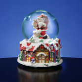 Santa with Lighted Victorian Village Snow Globe