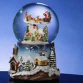 Santa Flying Over Village Snow Globe
